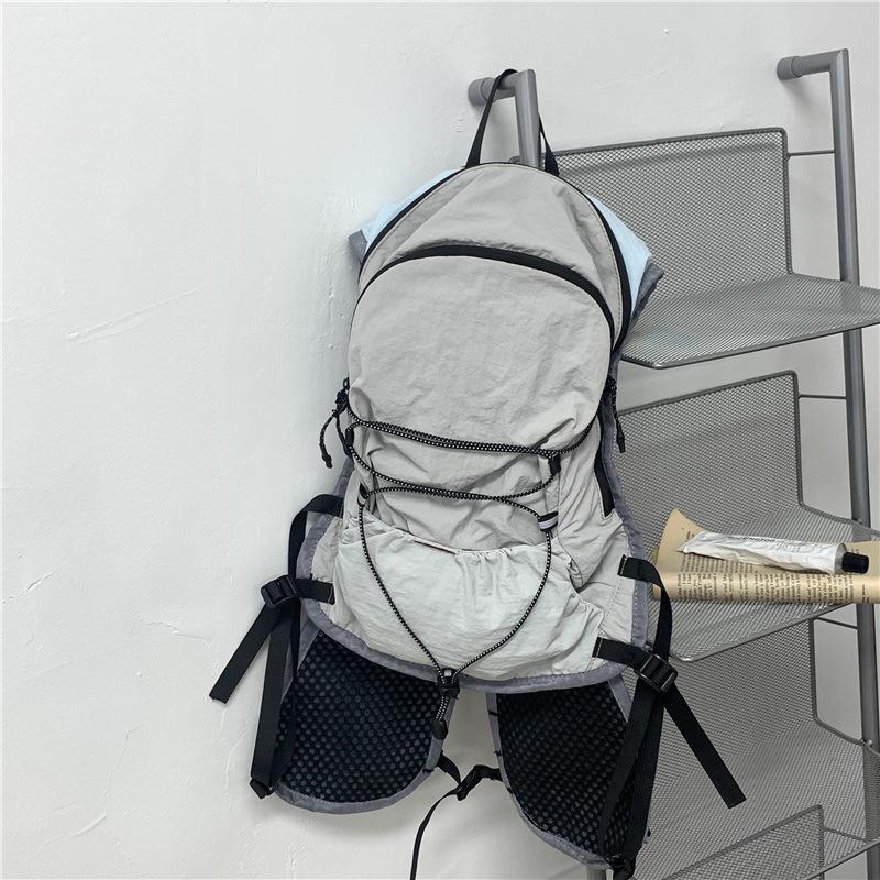 Schoolbag Functional Wind Backpack Men and Women 1011 New Lightweight Travel Backpack Lightweight Waterproof Mountaineering Bag Outdoor Socks Puppet