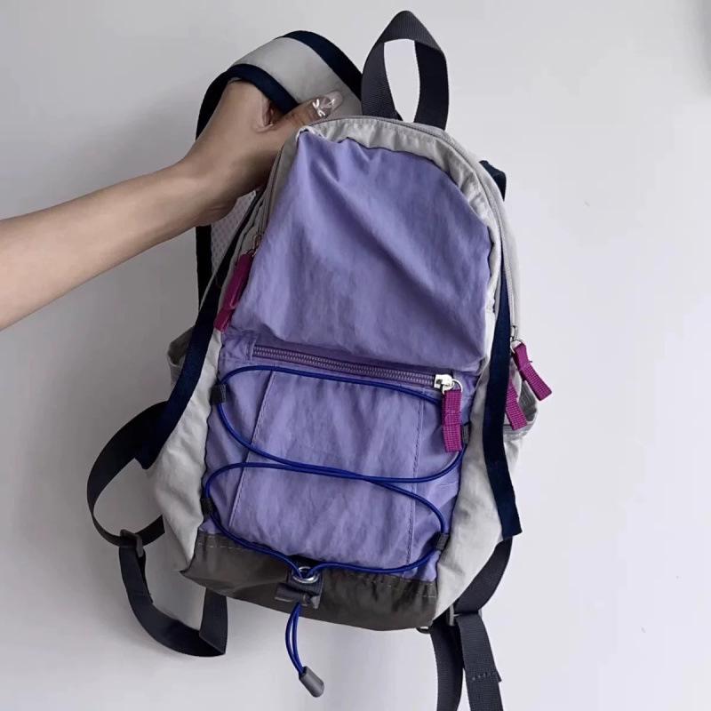 Легкий рюкзак для активного отдыха в стиле колорблок для студентов. фиолетовый