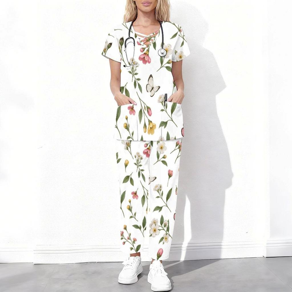 Women Plus Size White Floral Printed Scrub Set Cutout Neck Short Sleeve Pocket Top Long Pants
