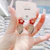 High-End Heart Tassel Earrings: Slimming, Long Dangle for Round Faces - Luxurious and Niche Design