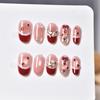 Christmas Red French Short Oval Nails with Bow & Snowflake Design