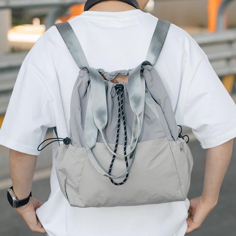 Lightweight sports backpack for women with drawstring drawstring pockets, versatile hand-held crossbody bag, travel backpack