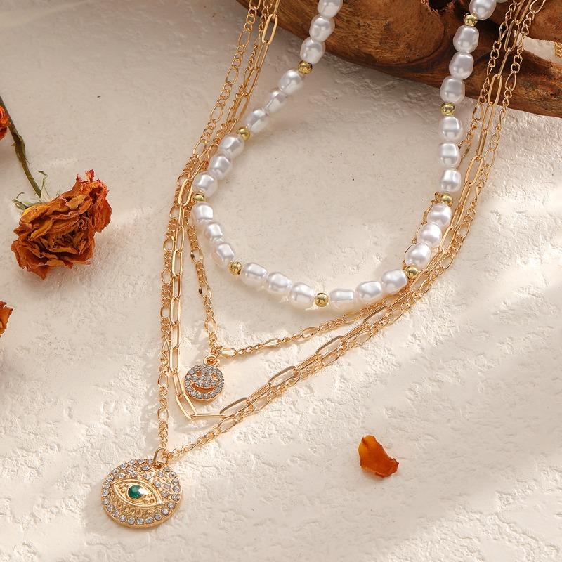 Temperament cold wind imitation pearl necklace retro light luxury diamond-encrusted smiley face devil's eye multi-layer necklace