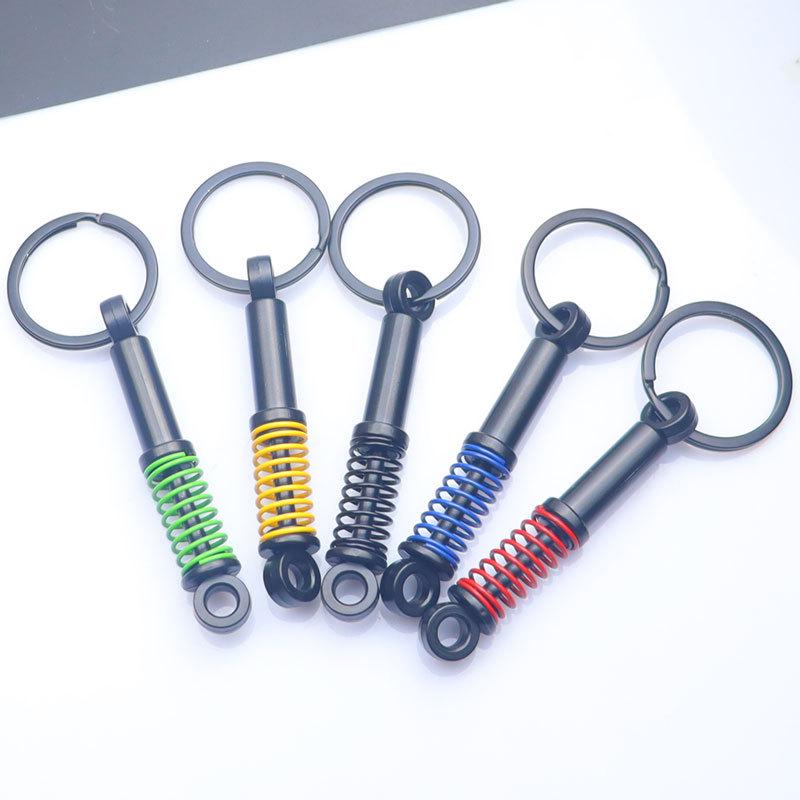 In-Stock Black Shock Absorber Keychain: Pressable Metal Spring Accessory - Perfect Small Gift