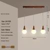 Modern Solid Wood Pendant Lamp with Three Heads, Walnut Finish, Japanese Style for Dining Rooms and Bars.