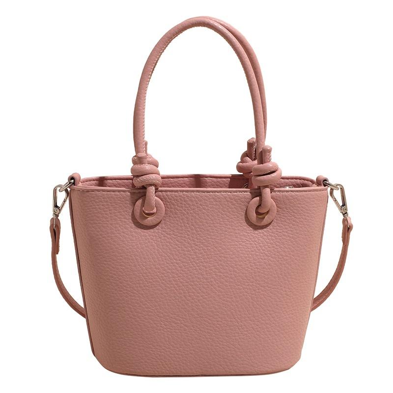 

Оптовая горячая распродажа высокое качество повседневная текстура личи однотонная портативная сумка-ведро универсальная простая ветрозащитная сумка-мессенджер для通勤 женщин