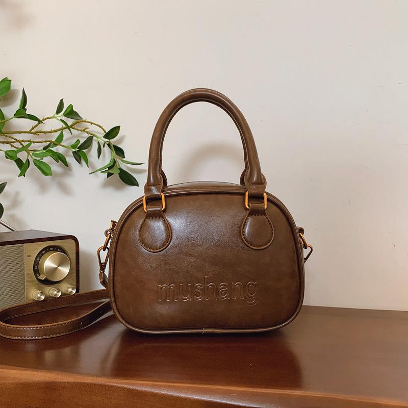 Niche Design Simple Texture Portable Bowling Bag Women's 2025 Autumn and Winter New Fashion Retro Messenger Shoulder Bag