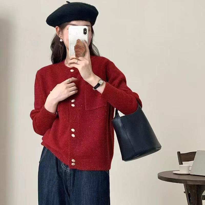 Real autumn and winter new gentle wind double-breasted design sense pocket knitted cardigan women's solid color crew neck sweater jacket