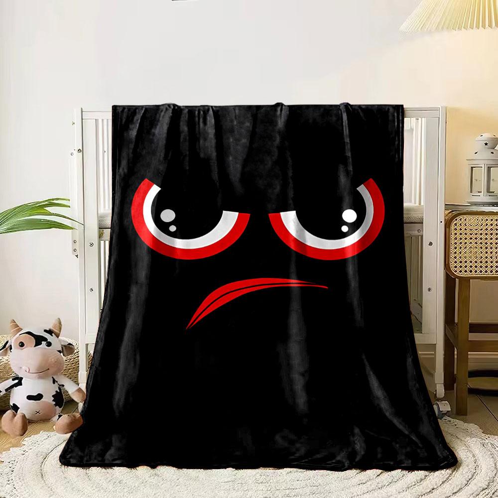 Red and white angry eyes with an arched red frown on a black background. for all seasons blanket lunch break throw gift