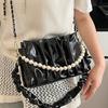Umhängetasche 2025 neue Nische Perle tragbare plissierte Cloud-Tasche Damen kleine frische Achseltasche lässige Messenger-Tasche