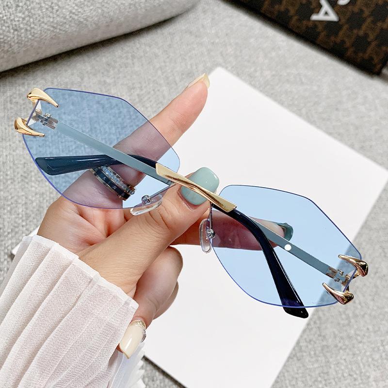 2026 Moda Nowe Damskie Okulary Przeciwsłoneczne UV400 Luksusowy Bezramkowy Design Kocie Oko Outdoor Rekreacja Wakacje Wysoka Jakość Damskie Okulary Przeciwsłoneczne