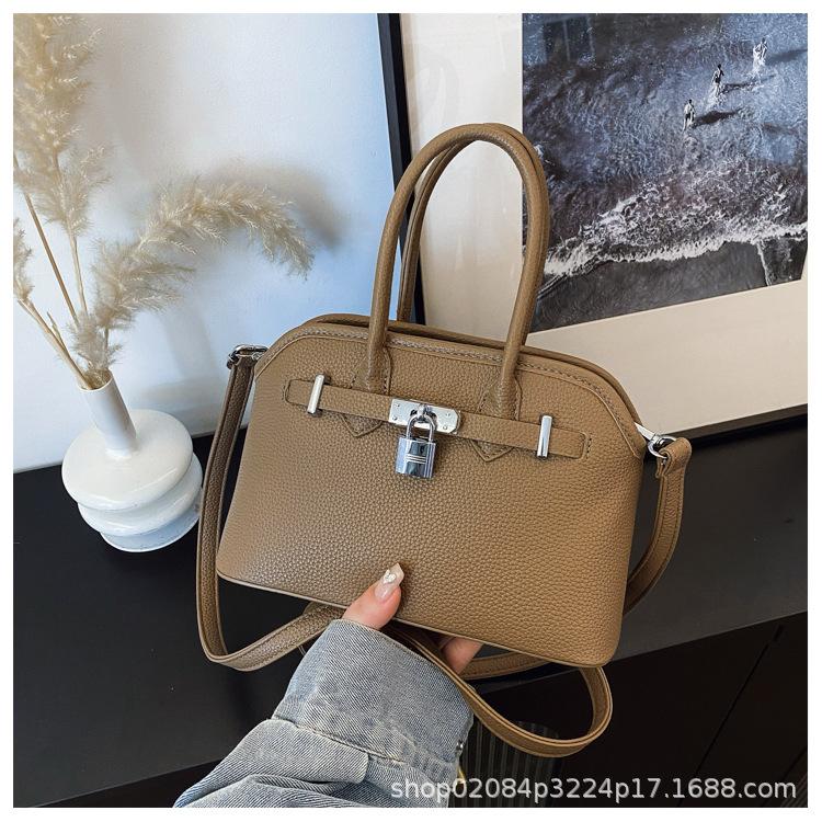2025 new women's lychee pattern solid color lock shoulder bag temperament niche versatile commuter portable messenger