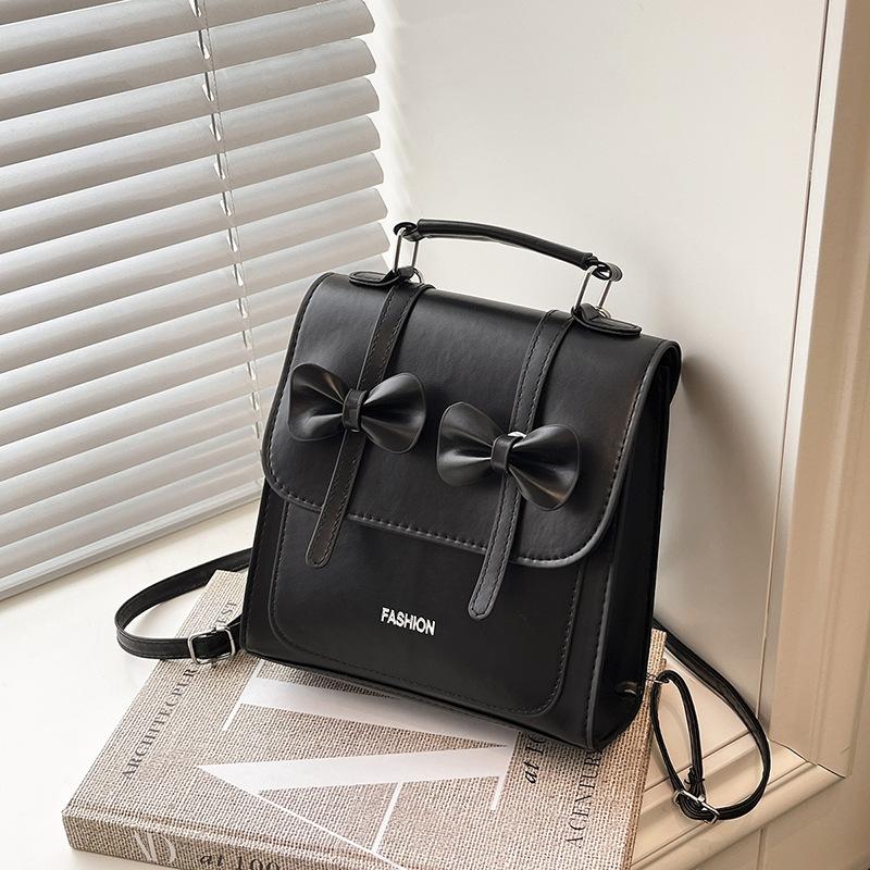 

South Korea solid color college style commuter backpack women 2025 new trend bow portable shoulder messenger bag