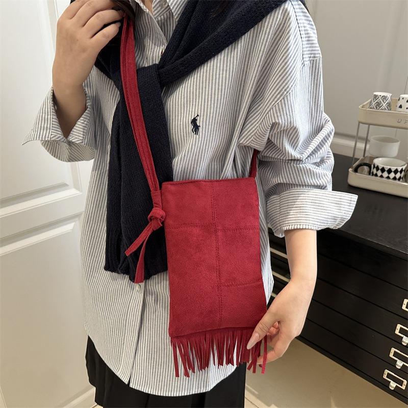Niche design new women's bags spring and summer retro simple trend fringed single shoulder messenger bag vertical mobile phone bag