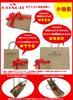 Portafoglio Coach lungo con zip around in pelle con cinturino con stampa di creature.