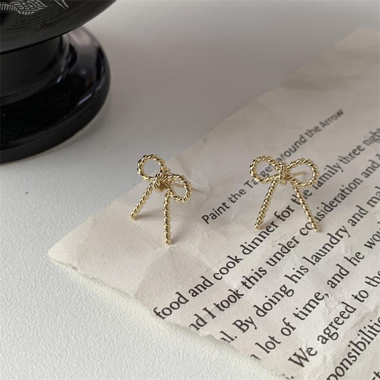 Elegant French Metal Twist Bow Stud Earrings: Versatile and Fashion-Forward Accessories