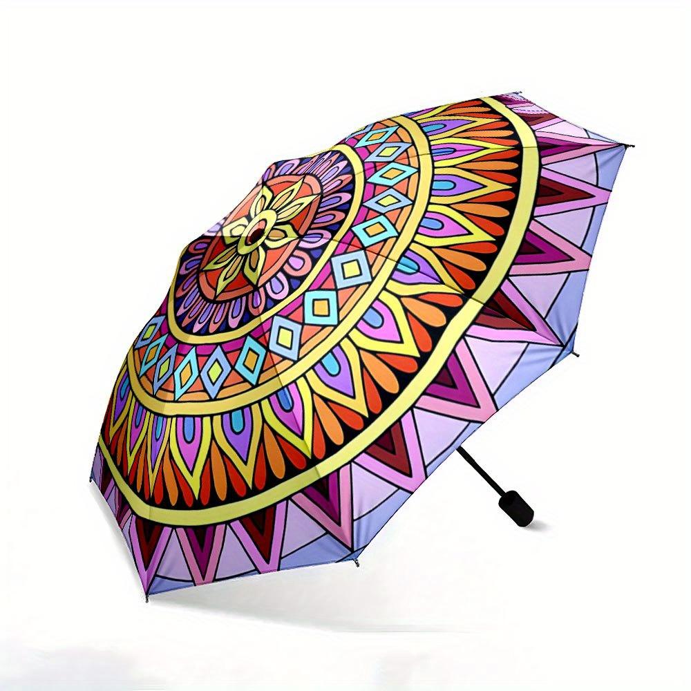 Folding Umbrella The umbrella features vibrant geometric mandala patterns with a central sunflower motif surrounded by layers