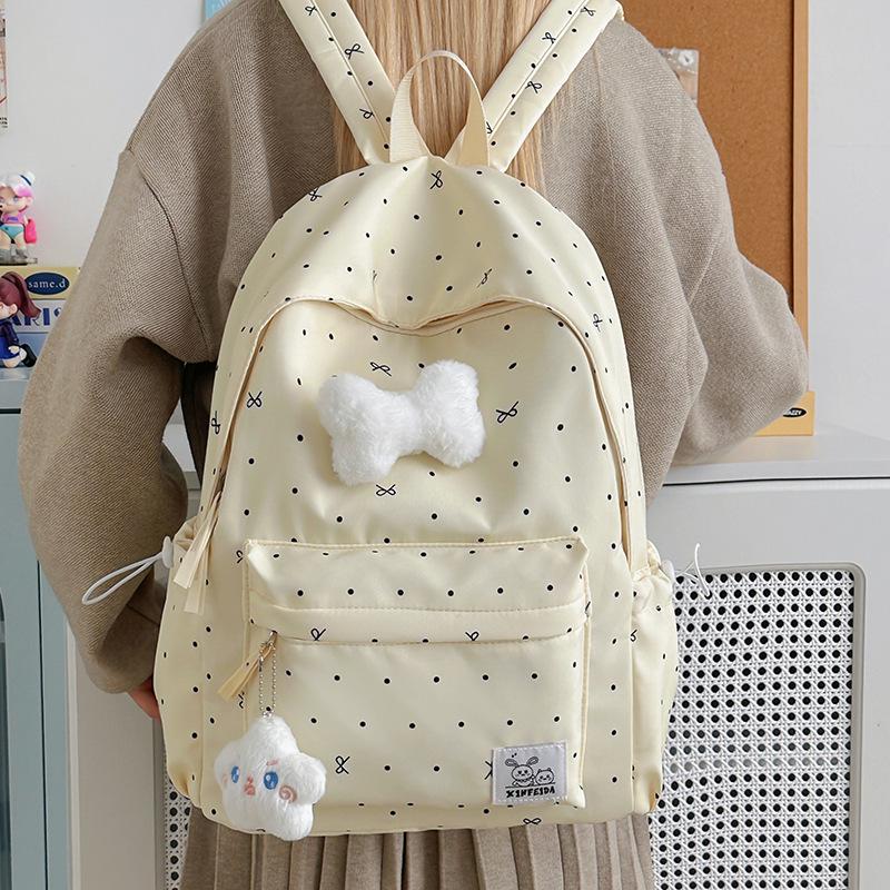 Polka Dot Bow Backpack for Teen Girls: Stylish and Versatile Schoolbag for Middle and High School Students.