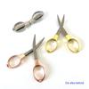 Rose Gold 8-Shaped Stainless Steel Folding Travel Scissors - Portable and Compact for Fishing and Eyeglass Needs.