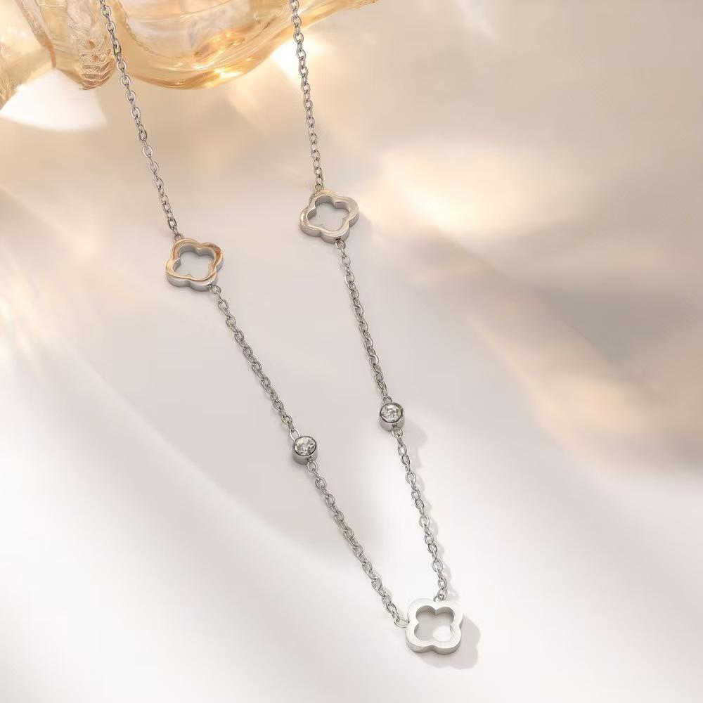 18K Gold Four-Leaf Clover Jewelry Set: Necklace, Bracelet, and Earrings in Titanium Steel with Zirconia.