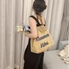 Korean Canvas Embroidered Tote: Versatile Women's Woven Beach Handbag with Tassel
