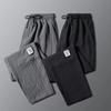 Męskie spodnie casualowe ze ściągaczem w pasie i modnym wzorem Harlan Pants Sportowe luźne spodnie w jednolitym kolorze