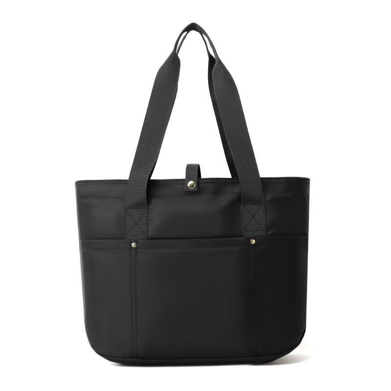 Women's portable folding storage bag with multiple compartments and adjustable shoulder strap for large capacity.