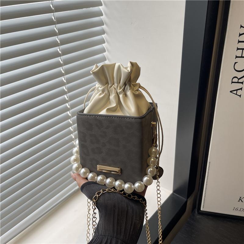 Hand Carry Pearl Bucket Bag Women's New Autumn Simple Fashion Shoulder Bag Niche High-end Textured Messenger Bag