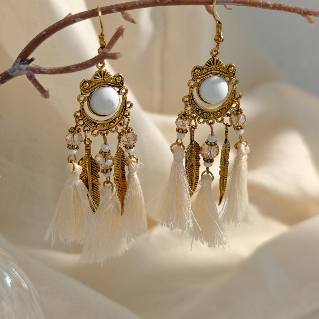 Retro ethnic style woven feathers long fringed earrings, bohemian high-end hollow rice bead earrings