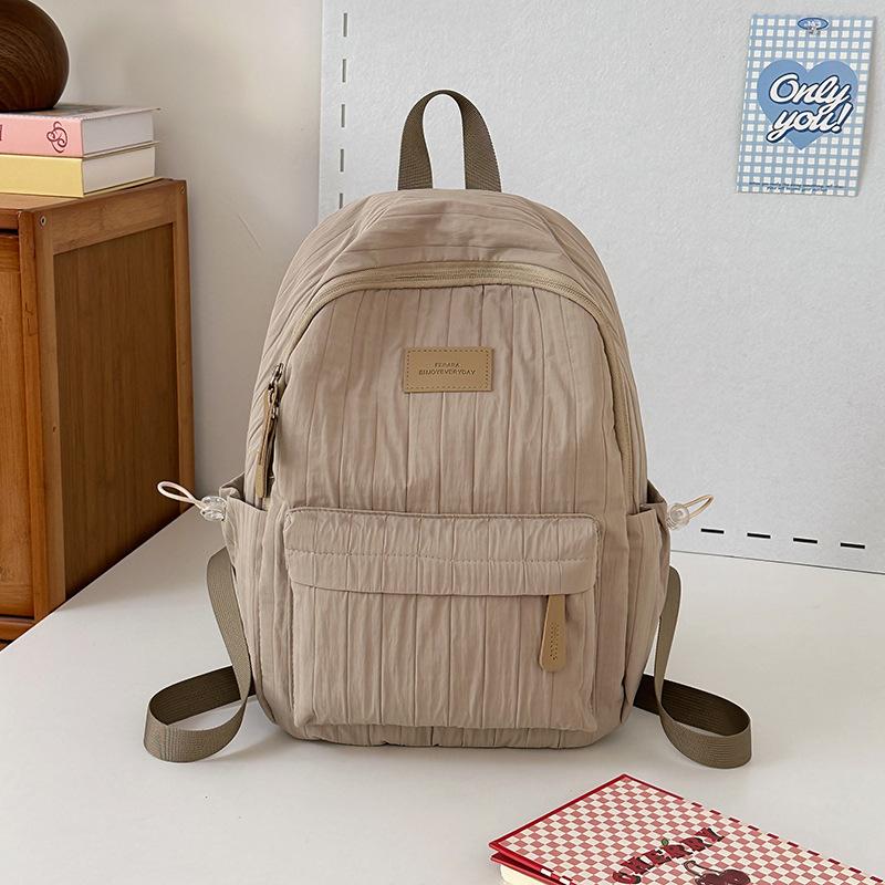 School bag junior high school girls large capacity solid color light primary school backpack high value girl versatile backpack