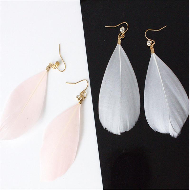 

Болтаться Красивый свет Привлекательные серьги Мода Элегантный симпатичный шарм Feather Party Exqutisite