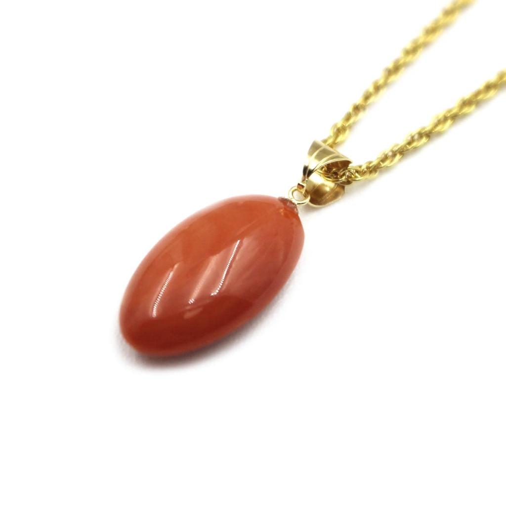 Peach coral oval pendant with 18K gold hardware gift wrapping and gift tag Includes a 45cm plated chain be changed to an 18K gold chain Undyed coral