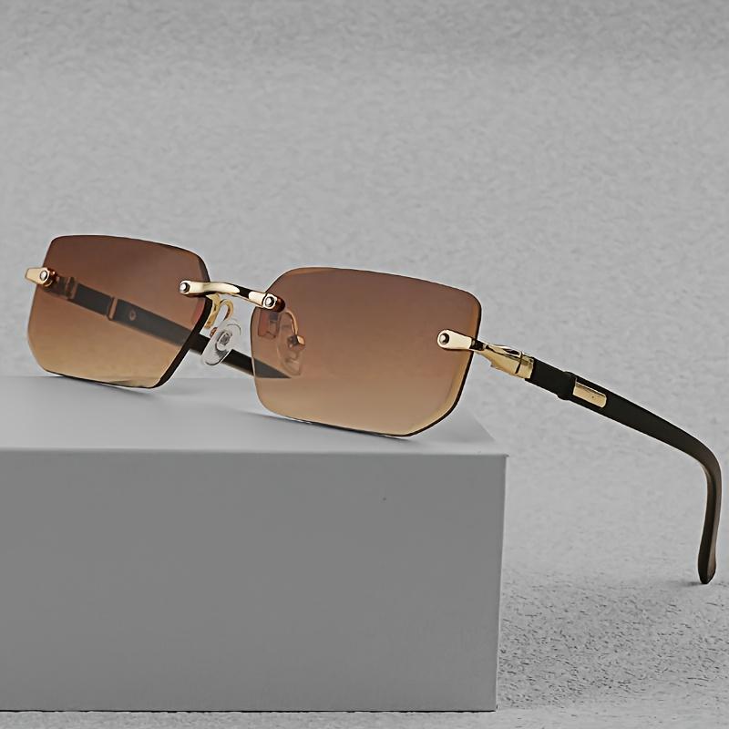 Stilvolle randlose rechteckige Modebrille für Männer & Frauen - Trendige schwarze Gläser mit goldfarbenem Metallrahmen