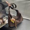 Brown Faux Suede Hobo Shoulder Bag with Cute Bear Charm. Large Capacity Casual Tote Bag for Women. Stylish and Versatile for Everyday Wear.
