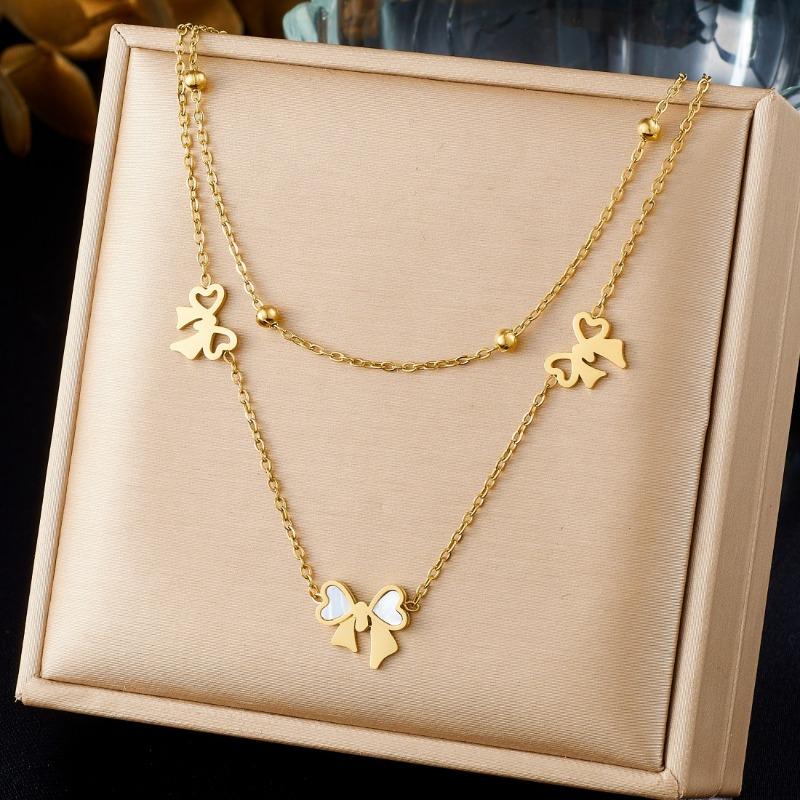 Gold Bow Charm Jewelry Set: Necklace and Bracelet with White Enamel Accents