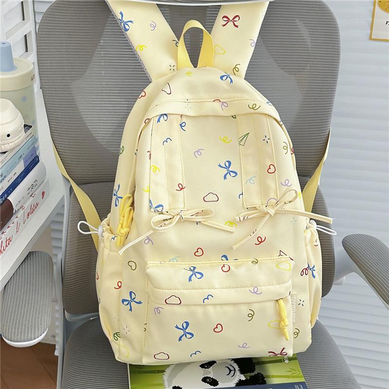 Cute Bow Tie Print School Backpack Lightweight Nylon Zipper Daypack with Front Pocket for Teen Girls Daily Travel
