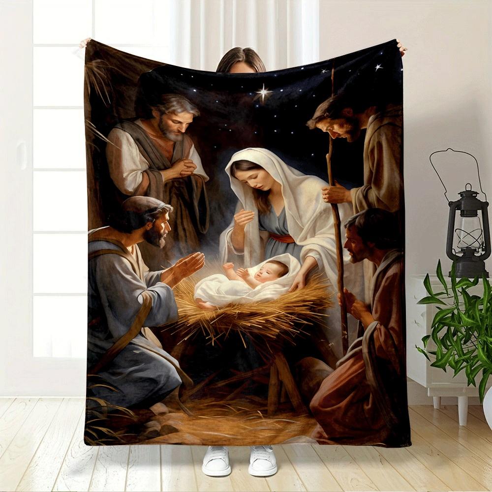 A radiant newborn in a manger surrounded by figures under a glowing sky. for all seasons blanket lunch break throw gift
