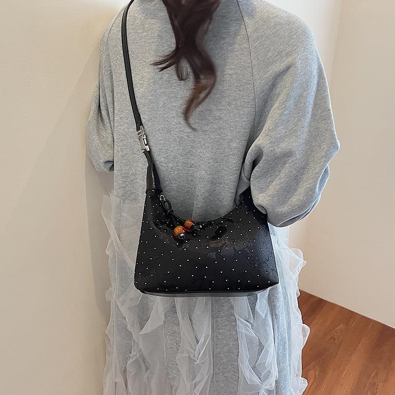 Handheld shoulder bag women's spring and summer new dumpling bag high-end commuter messenger bag