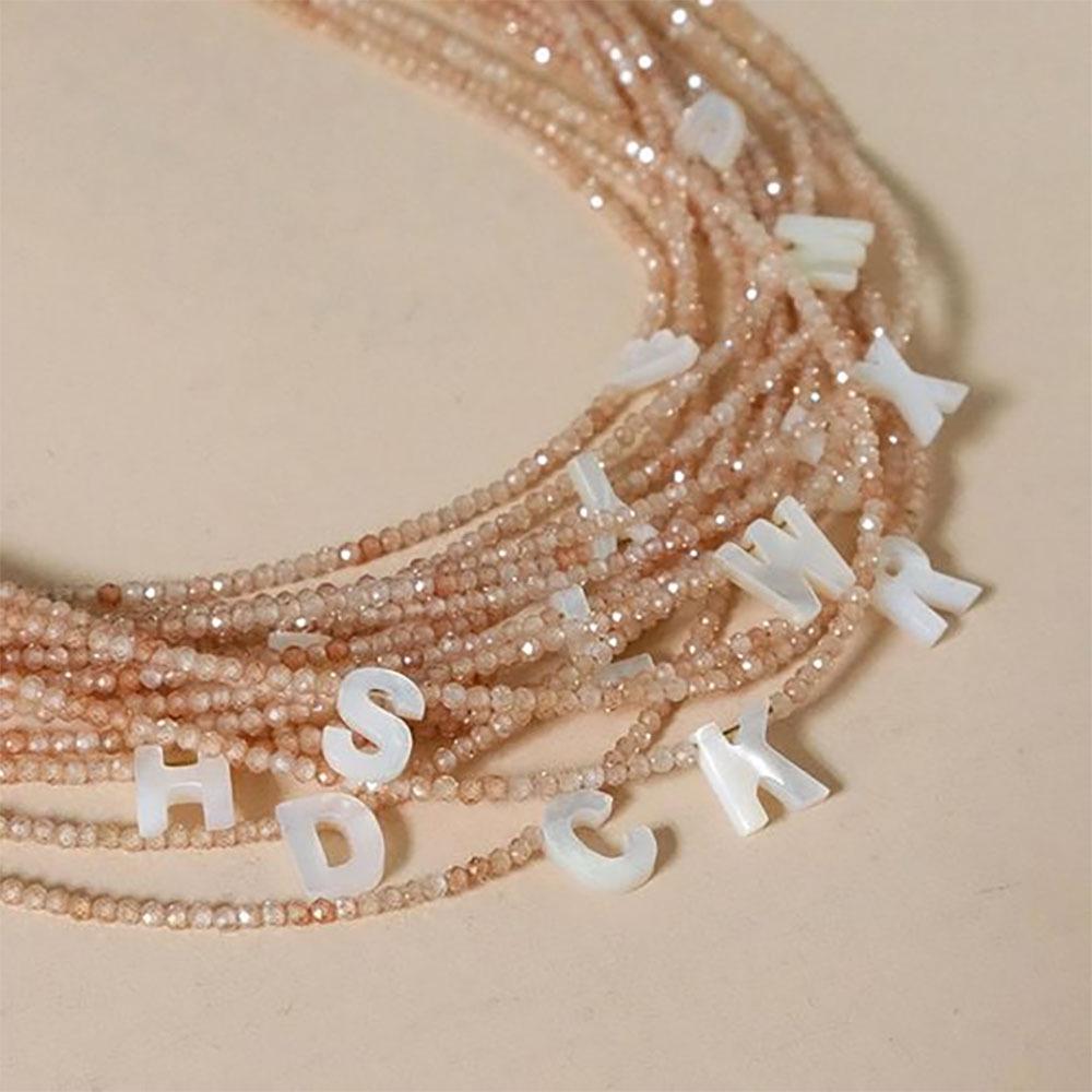 Elegant 2m Zircon Beaded Clavicle Chain: 26-Letter Deep Sea Shell Necklace for Women.