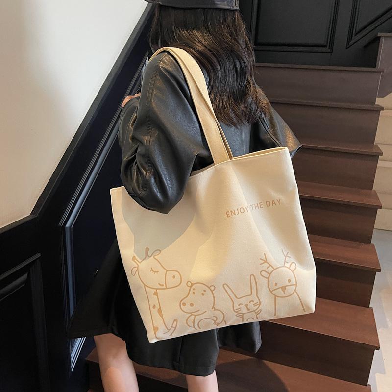 2025 autumn new leisure commuter large-capacity canvas bag women's niche shoulder bag graffiti portable tote bag