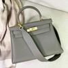 The New High-end Togo Top Layer Cowhide Wide Shoulder Strap Fashionable Single-shoulder Crossbody Hand-held Women's Bag Is Trendy