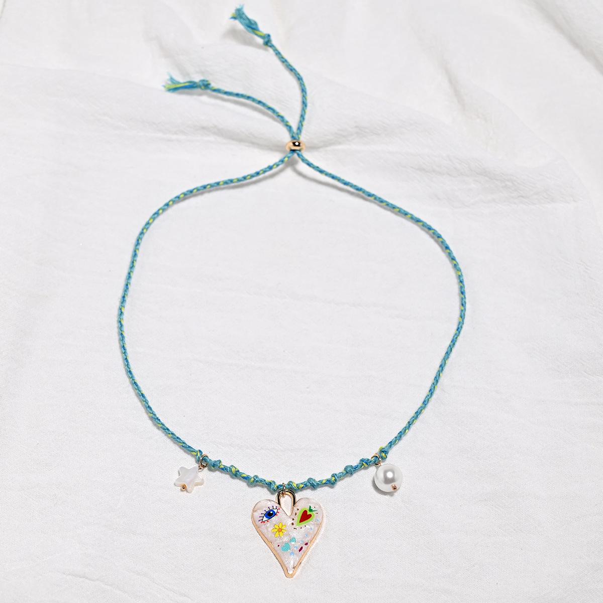Богемское веревочное колье с большим сердцем и подвеской-звездой из искусственного жемчуга