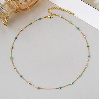 Damski naszyjnik na obojczyk z miedzi platerowanej złotem, z koralikami typu seed beads, o niszowym designie