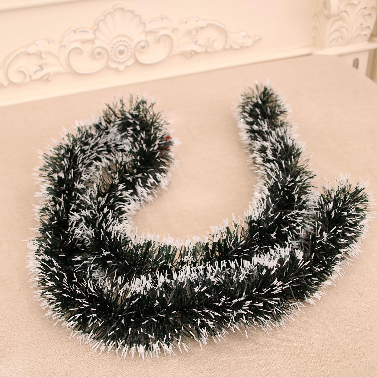 

Festive Dark Green Christmas Ornaments: Tinsel, Garland, and Mistletoe with White Trim