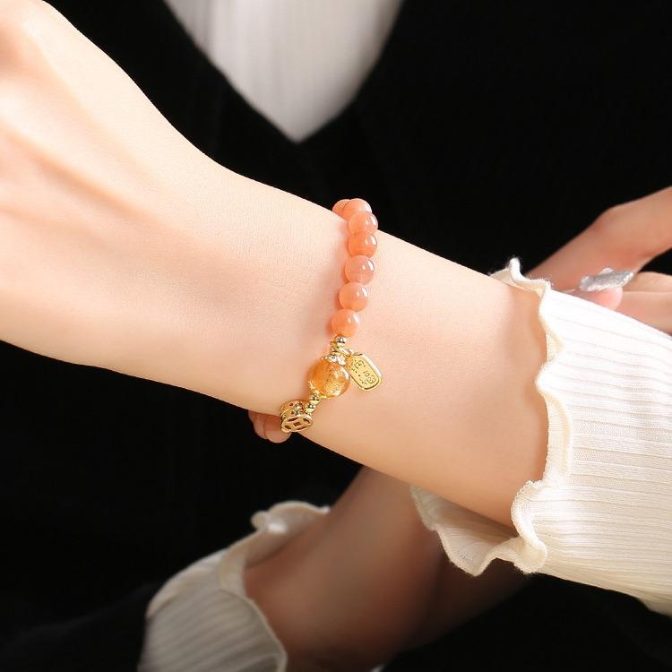 Sunstone bracelet for women, symbolizing the rising sun, love, and radiant light, with fragrant ash and glass beads