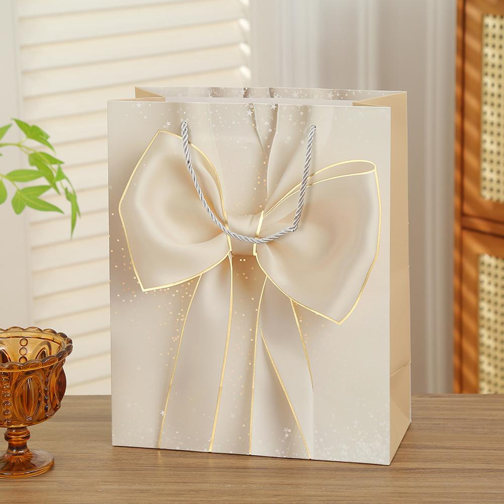 

20pcs Luxury Bow Gift Bags Gold Foil Paper Gift Packaging Bags with Handles for Holiday Wedding Birthday Party Gifts 20pcs&23x18x10cm
