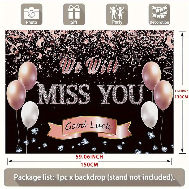 A photo backdrop for a retirement farewell celebration featuring a rose gold banner that reads "We will miss you"