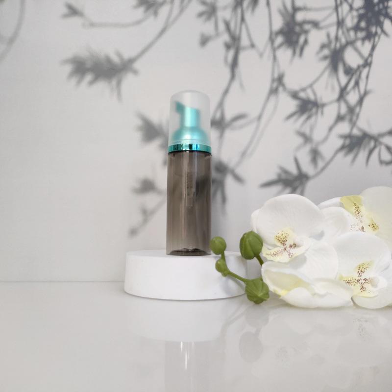 Available 60ml Transparent Black Foam Mousse Bottle for Face Wash and Travel-friendly Cosmetic Packaging.