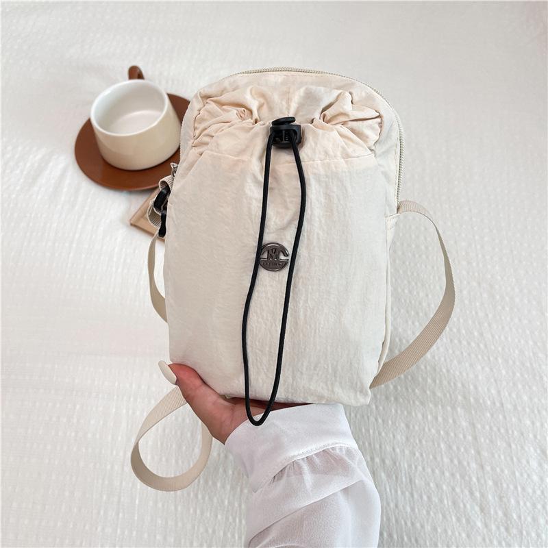 Women's Multi-functional Crossbody Bag: Multi-Compartment, Personalized Water Bottle Holder, Phone Storage, Versatile Travel Backpack.