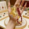 Golden Phone Charm: Good Fortune Shell Keychain, Peace & Joy Bag Ornament, Phone Lanyard Gift